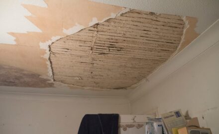 A room with a ceiling that has been torn off