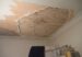 A room with a ceiling that has been torn off
